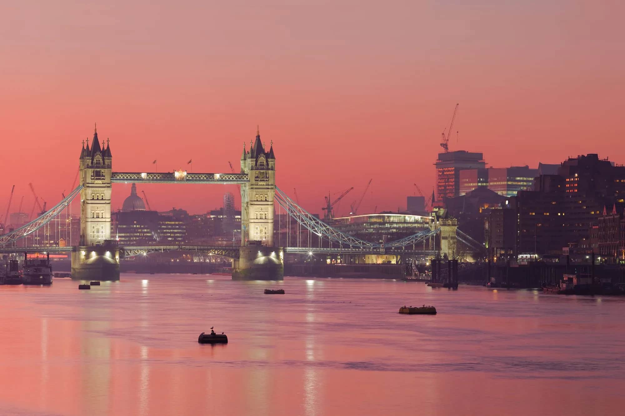 Tower Bridge and the London skyline along the Thames at sunset