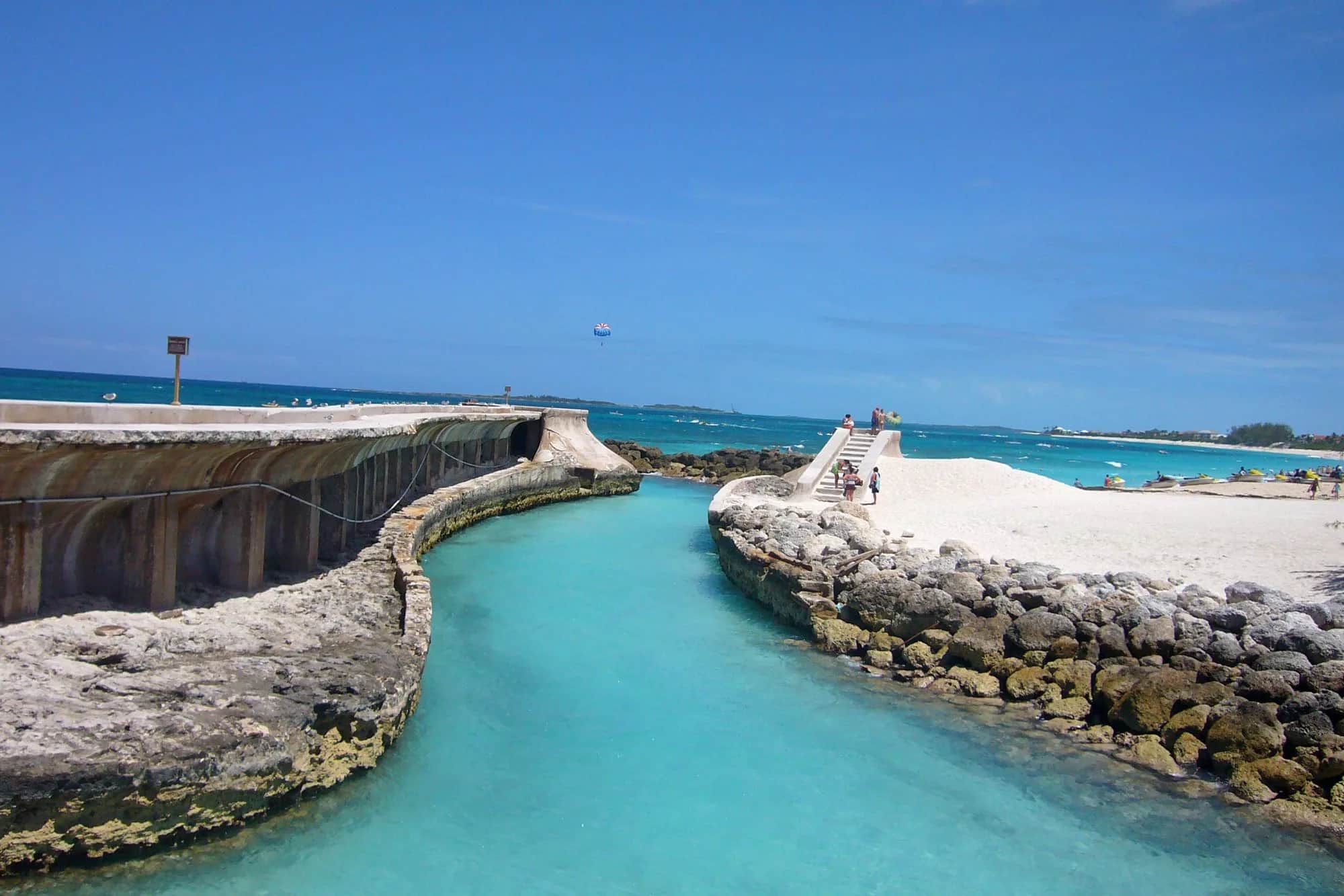 Clear turquoise water and white sand along the coast near Nassau, Bahamas