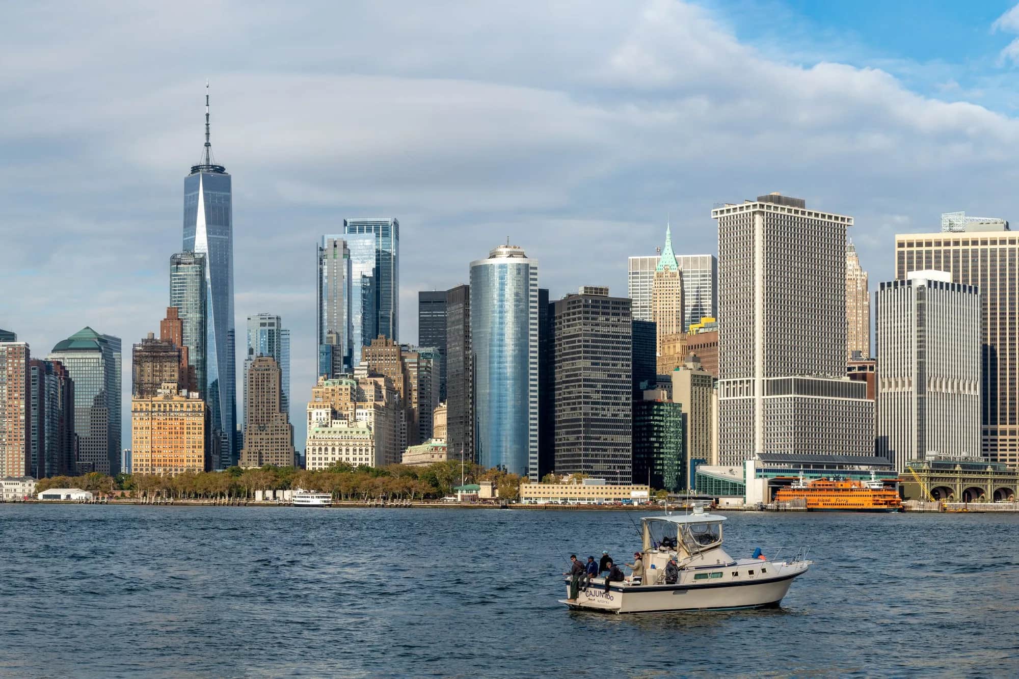 The Lower Manhattan skyline in New York seen from the water at dusk