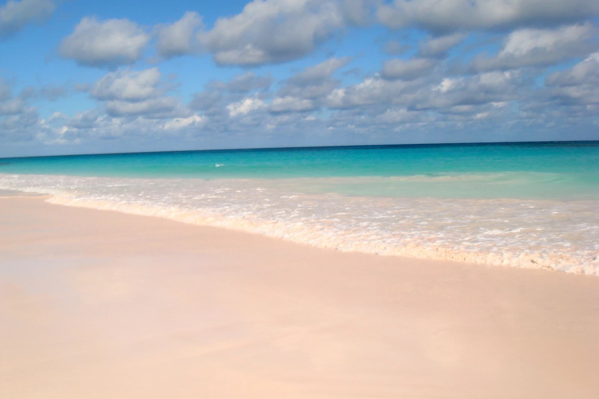 Harbour Island's famous pink sand beach meeting turquoise Bahamian waters