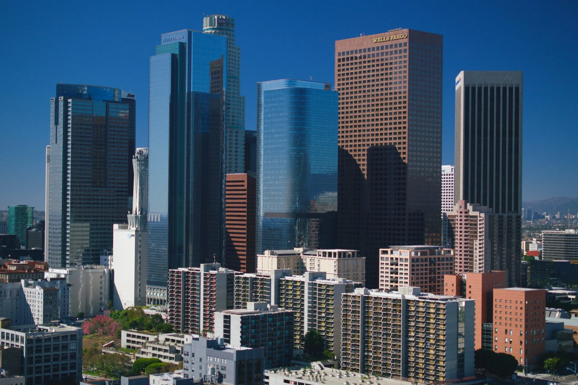 The downtown Los Angeles skyline against a clear blue sky