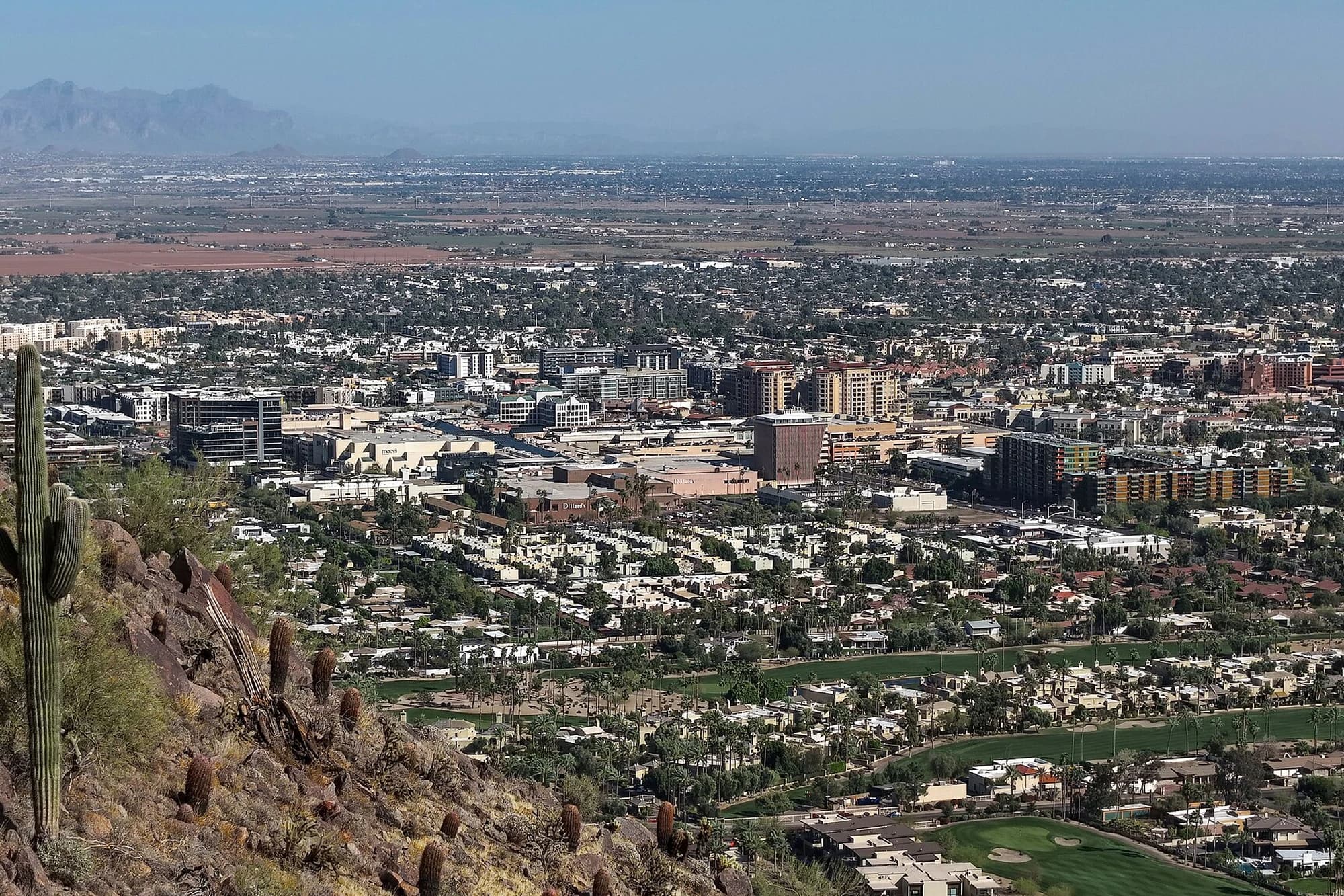 Aerial view of downtown Scottsdale, Arizona, viewed from Camelback Mountain, with the desert cityscape stretching into the distance
