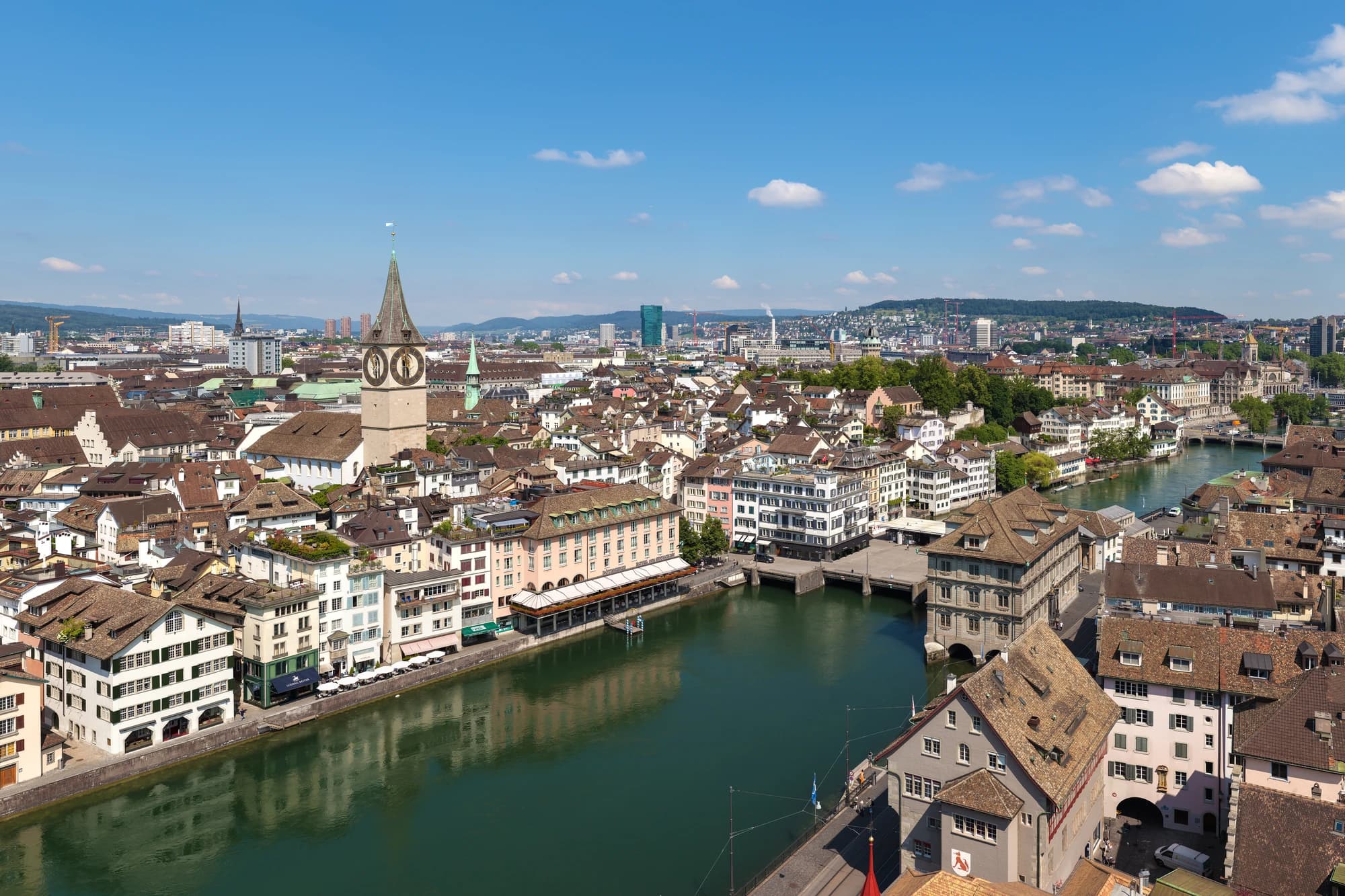 Aerial view of Zurich's Old Town, St. Peter's church tower, and the Limmat river