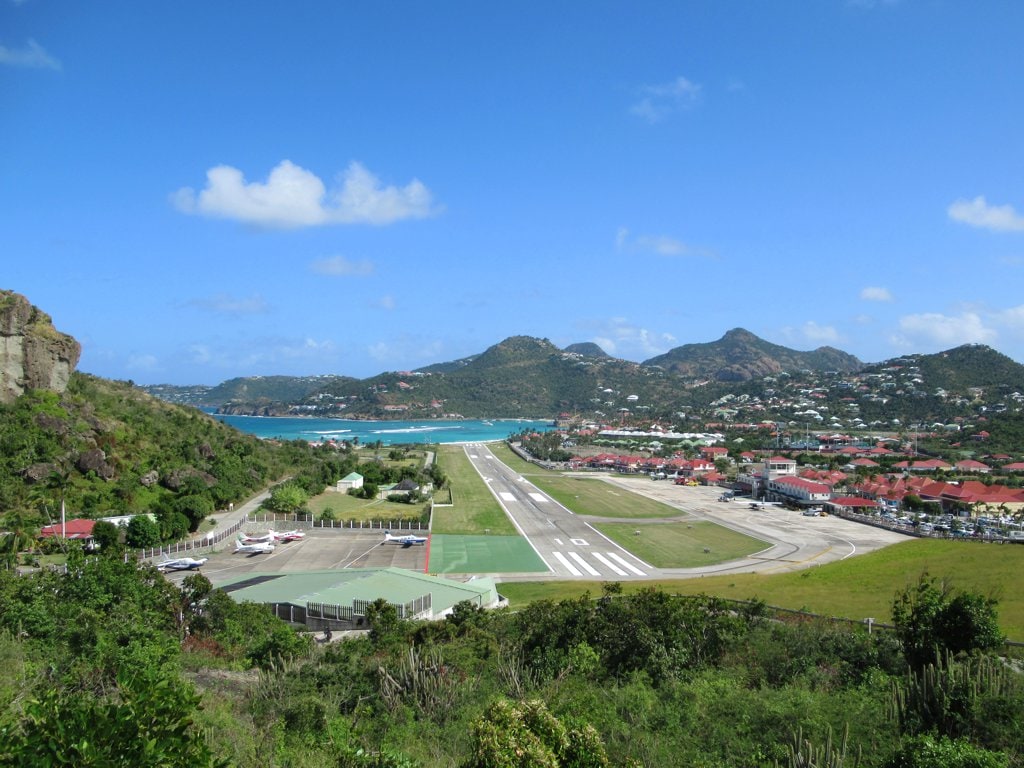 Short runway of Gustaf III Airport with hillside approach in Saint Barthelemy