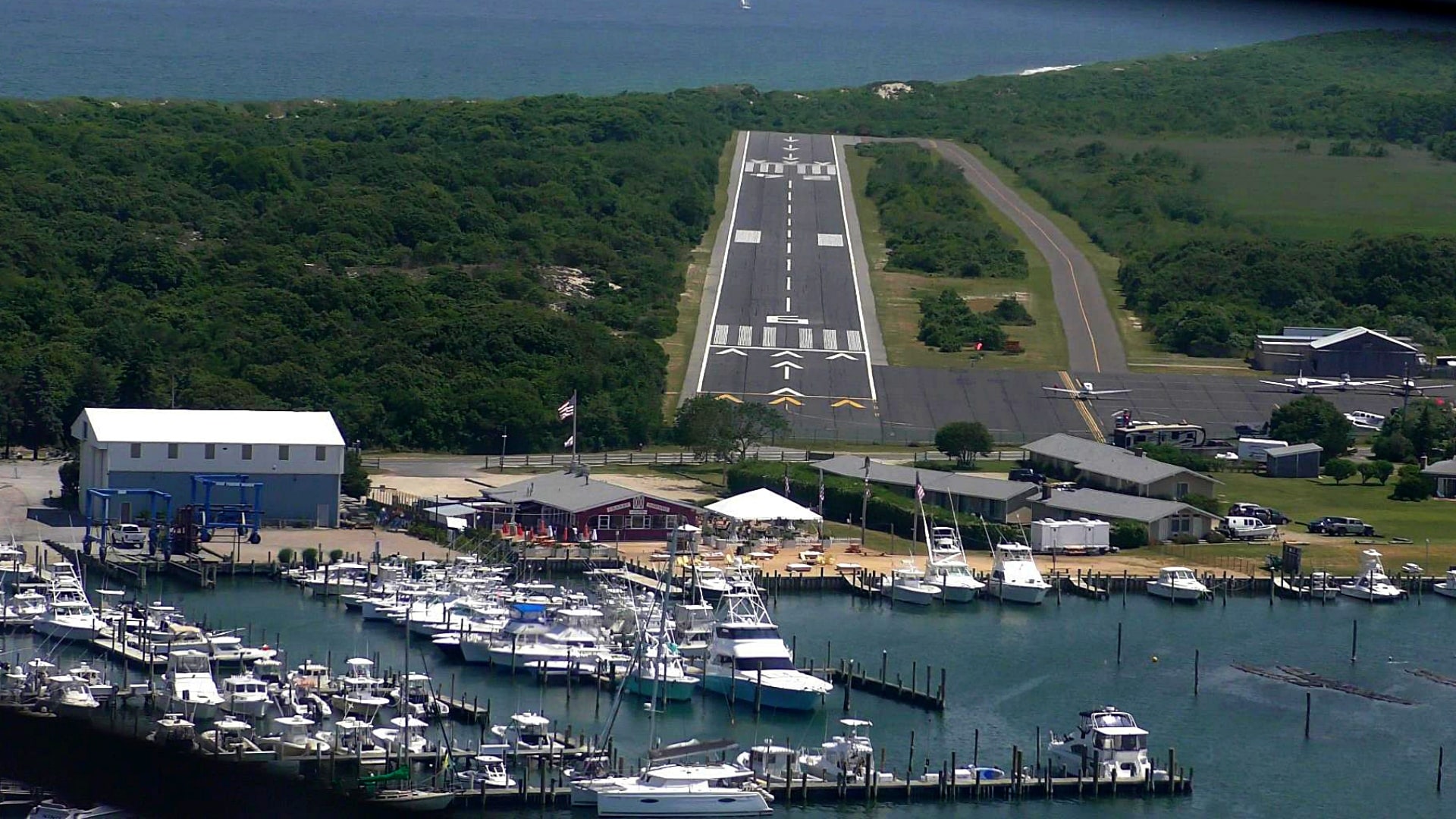 Aerial view of an aircraft landing on the runway at Montauk Airport on the eastern tip of Long Island