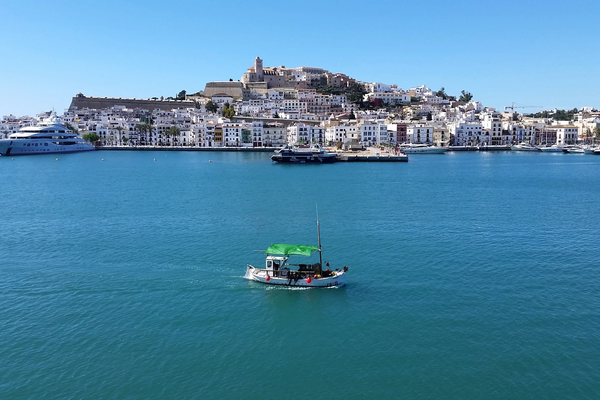 View over Ibiza's Dalt Vila old town walls and harbor toward the Mediterranean Sea