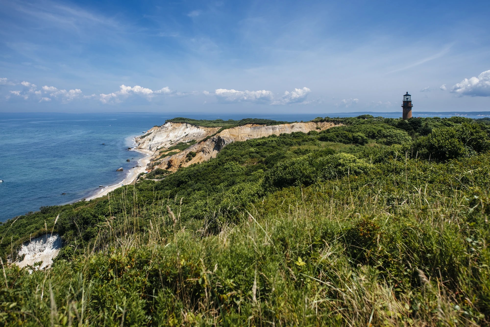 Aerial view of the Aquinnah Cliffs and Gay Head Lighthouse on Martha's Vineyard, Massachusetts, on a summer day