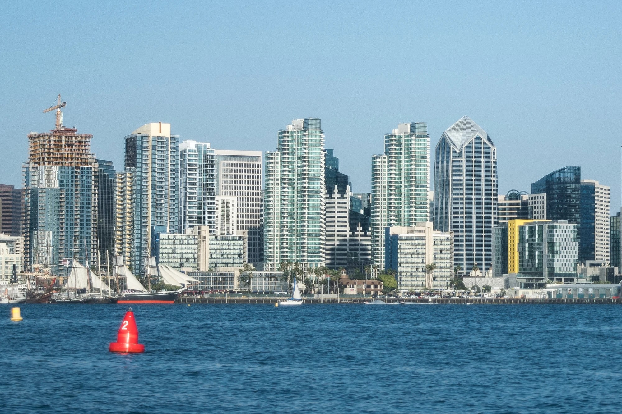 Downtown San Diego skyline viewed from the water with sailboats in the foreground