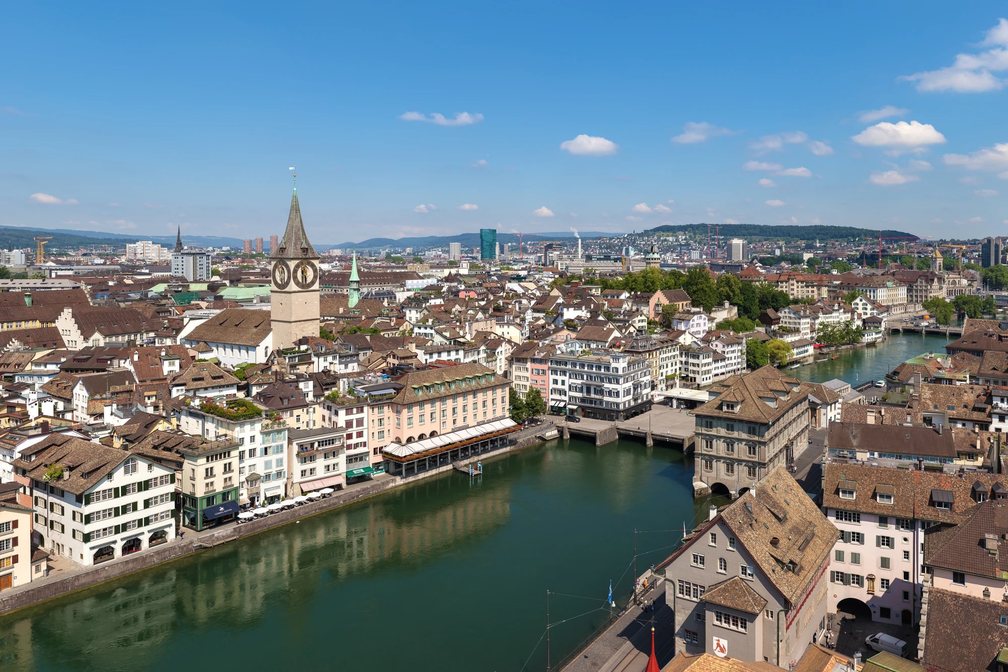 Aerial view of Zurich's Old Town, St. Peter's church tower, and the Limmat river